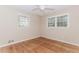 Bright bedroom features hardwood floors and abundant natural light from two windows at 1152 Old Coach Rd, Stone Mountain, GA 30083