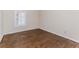 Bedroom featuring hardwood floors, neutral paint, baseboard trim and natural lighting at 1152 Old Coach Rd, Stone Mountain, GA 30083