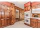 Eat-in kitchen with lots of storage space, white tile floors and view to the side of the house at 1152 Old Coach Rd, Stone Mountain, GA 30083