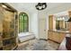 Bathroom with large shower, tub and vanity features a unique stained glass window at 2726 Mabry Ne Rd, Atlanta, GA 30319