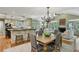 Open dining and living room with hardwood floors, fireplace and natural light at 2726 Mabry Ne Rd, Atlanta, GA 30319
