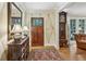 Foyer features decorative wall paper, hardwood floors and antique furniture and grandfather clock at 2726 Mabry Ne Rd, Atlanta, GA 30319