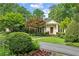 Charming home features a manicured front yard with lush landscaping and a circular driveway at 2726 Mabry Ne Rd, Atlanta, GA 30319