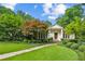 Charming home with meticulous landscaping, featuring a stone pathway and vibrant green lawn at 2726 Mabry Ne Rd, Atlanta, GA 30319