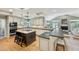 Open kitchen flows into the living room; features island, bar, and stainless steel appliances at 2726 Mabry Ne Rd, Atlanta, GA 30319