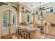 Bright, eclectic kitchen features custom cabinetry, a farmhouse sink, tiled countertops, and stylish adjacent seating area at 2726 Mabry Ne Rd, Atlanta, GA 30319