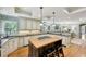 Open kitchen features island with gas cooktop, breakfast bar, and stainless steel appliances at 2726 Mabry Ne Rd, Atlanta, GA 30319