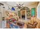 Charming living room filled with an eclectic mix of decor, built-in bookshelves, comfortable seating, and unique artwork at 2726 Mabry Ne Rd, Atlanta, GA 30319