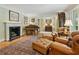 Classic living room with a fireplace, piano, and sophisticated decor at 2726 Mabry Ne Rd, Atlanta, GA 30319