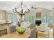 Spacious living room with a fireplace, hardwood floors, and adjacent dining area and kitchen at 2726 Mabry Ne Rd, Atlanta, GA 30319