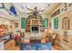 Charming living room filled with an eclectic mix of decor, built-in bookshelves, comfortable seating, and unique artwork at 2726 Mabry Ne Rd, Atlanta, GA 30319