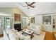 Bright living room with a fireplace, built-in shelves and large windows offering exterior views at 2726 Mabry Ne Rd, Atlanta, GA 30319