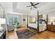 The spacious main bedroom has a sitting area, 4-poster bed, and natural light at 2726 Mabry Ne Rd, Atlanta, GA 30319
