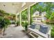 Charming covered patio with beautiful blue pillows and lush landscaping at 2726 Mabry Ne Rd, Atlanta, GA 30319
