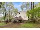 Backyard with deck and stairs offers an outdoor living space with view of trees and green landscape at 3450 Brookhill Cir, Marietta, GA 30062