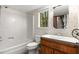 Functional bathroom with a tub and shower combination, complemented by a wood vanity at 3450 Brookhill Cir, Marietta, GA 30062