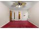 Bedroom with two doorways, ceiling fan, neutral walls, and natural light from the window at 3450 Brookhill Cir, Marietta, GA 30062