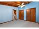 Cozy bedroom with light blue walls, wood trim, ceiling fan and closet with access to other rooms at 3450 Brookhill Cir, Marietta, GA 30062