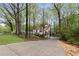 Charming exterior view of home featuring a well-maintained driveway and lush landscaping in a wooded area at 3450 Brookhill Cir, Marietta, GA 30062