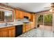 Kitchen featuring wood cabinets, white countertops, and sliding glass door to the outdoor deck at 3450 Brookhill Cir, Marietta, GA 30062