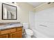 Bathroom featuring single sink, granite counters, tub-shower combo and tile flooring at 5213 Pinnacle Point Ct, Norcross, GA 30071