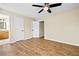 Spacious bedroom offers wood flooring and easy access to ensuite bathroom at 5213 Pinnacle Point Ct, Norcross, GA 30071