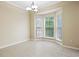 Cozy dining area filled with natural light from the large bay windows overlooking greenery at 5213 Pinnacle Point Ct, Norcross, GA 30071