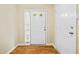 Bright entryway with hardwood floors, white door and sidelight at 5213 Pinnacle Point Ct, Norcross, GA 30071