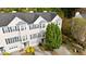 View of the home featuring bay windows, attached garages, and mature trees at 5213 Pinnacle Point Ct, Norcross, GA 30071