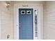 Charming blue front door with decorative trim and house number 5213 at 5213 Pinnacle Point Ct, Norcross, GA 30071