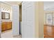 Hallway with a closet, showing the entrance to the main bedroom with natural lighting at 5213 Pinnacle Point Ct, Norcross, GA 30071