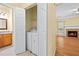 Hallway with a closet, showing the entrance to the main living space with a fireplace at 5213 Pinnacle Point Ct, Norcross, GA 30071