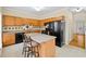 Kitchen featuring oak cabinets, granite counters, tile backsplash and tile flooring at 5213 Pinnacle Point Ct, Norcross, GA 30071