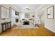 Staged living room featuring hardwood floors, fireplace and neutral decor at 5213 Pinnacle Point Ct, Norcross, GA 30071