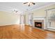 Spacious living room with hardwood floors, fireplace, windows and french doors at 5213 Pinnacle Point Ct, Norcross, GA 30071