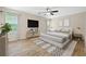 Spacious bedroom with natural light, ceiling fan, and stylish decor; a perfect retreat at 5213 Pinnacle Point Ct, Norcross, GA 30071