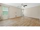 Large main bedroom space featuring hard wood floors and ample natural lighting at 5213 Pinnacle Point Ct, Norcross, GA 30071