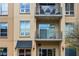 Multi-story building featuring multiple balconies with tables and chairs at 711 Cosmopolitan Ne Dr # 213, Atlanta, GA 30324