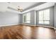Spacious bedroom with laminate floors, tray ceiling, and large windows for natural light at 711 Cosmopolitan Ne Dr # 213, Atlanta, GA 30324