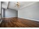 Bright and airy bedroom with hardwood floors, neutral walls, and a ceiling fan at 711 Cosmopolitan Ne Dr # 213, Atlanta, GA 30324