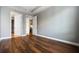 A bedroom featuring hardwood floors and a view into the kitchen at 711 Cosmopolitan Ne Dr # 213, Atlanta, GA 30324