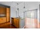 Bright kitchen area includes granite countertops, wooden cabinets, and stainless steel dishwasher at 711 Cosmopolitan Ne Dr # 213, Atlanta, GA 30324