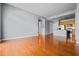 Bright apartment living space features hardwood floors and an open kitchen area at 711 Cosmopolitan Ne Dr # 213, Atlanta, GA 30324