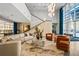 Inviting building lobby features lounge seating, large windows and a staircase with contemporary fixtures at 711 Cosmopolitan Ne Dr # 213, Atlanta, GA 30324