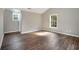 Bright bedroom has wood floors, and two sunny windows at 8908 Brandy Rose, Douglasville, GA 30134