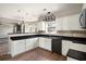 Modern kitchen with white cabinets, granite countertops, dark appliances and hardwood floors at 8908 Brandy Rose, Douglasville, GA 30134