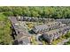 Aerial view of community with winding roads, trees and well-maintained townhomes at 1129 Cordia Nw Ave, Atlanta, GA 30318