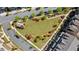 An overhead shot of a landscaped park, surrounded by townhomes and streets in a suburban setting at 1129 Cordia Nw Ave, Atlanta, GA 30318