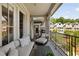 Spacious balcony with cozy seating and a view of the lush backyard and surrounding homes at 1129 Cordia Nw Ave, Atlanta, GA 30318