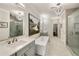 Serene bathroom with a standalone tub, glass shower, and a long vanity at 1129 Cordia Nw Ave, Atlanta, GA 30318